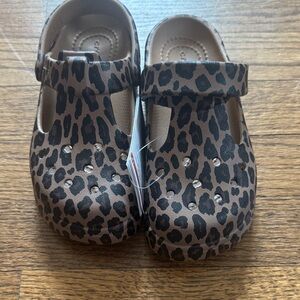 CROCS Kids Leopard Print Clogs in Brown and Black
